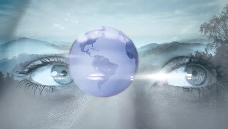 animation of globe and eyes of caucasian woman over landscape