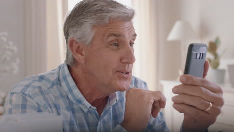 happy-mature-man-having-video-chat-using-smartphone-grandfather-waving-at-baby-enjoying-chatting-to-grandchild-on-mobile-phone-4k-footage