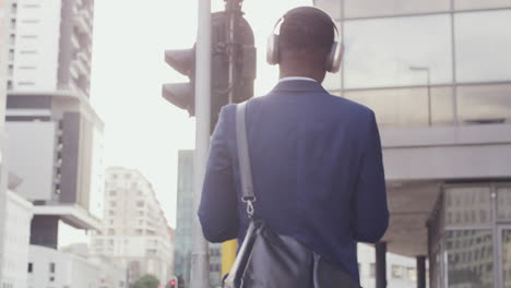 Fun-businessman-enjoying-listening-to-music