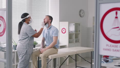 doctor making smear test for coronavirus