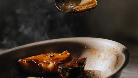 sautéing sweet potatoes in a sweet brown sauce in slow motion