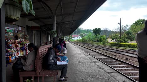 passengers waiting for train at haputale train station, a popular tourist destination in the hill country of sri lanka