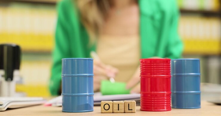 Word oil from wooden cubes near barrels against woman
