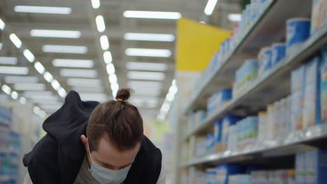 person shopping at a grocery store during a pandemic