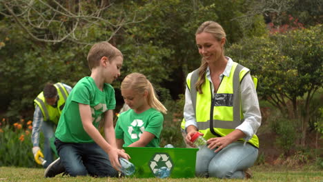 happy family collecting rubbish