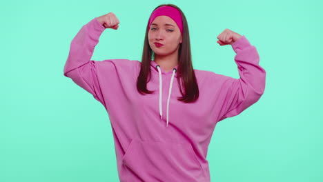 girl showing biceps, feeling power strength to fight for rights, energy to gain success win fight