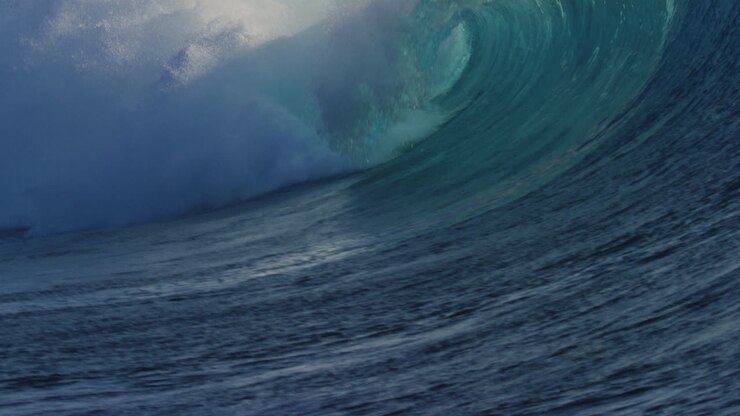 Empty powerful strong textured wave of Cloudbreak surf spot in Fiji