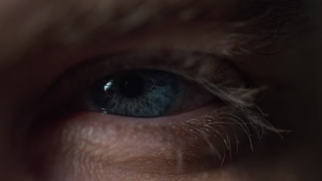 Close-up-view-of-young-man-opening-eye-with-beautiful-blue-iris.-Macro-video-.