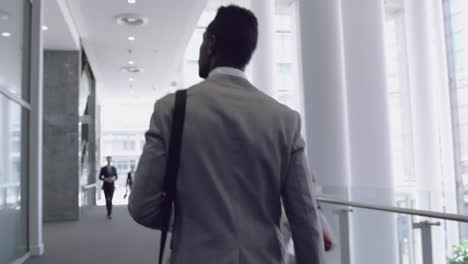 businessman walking in the corridor at office 4k