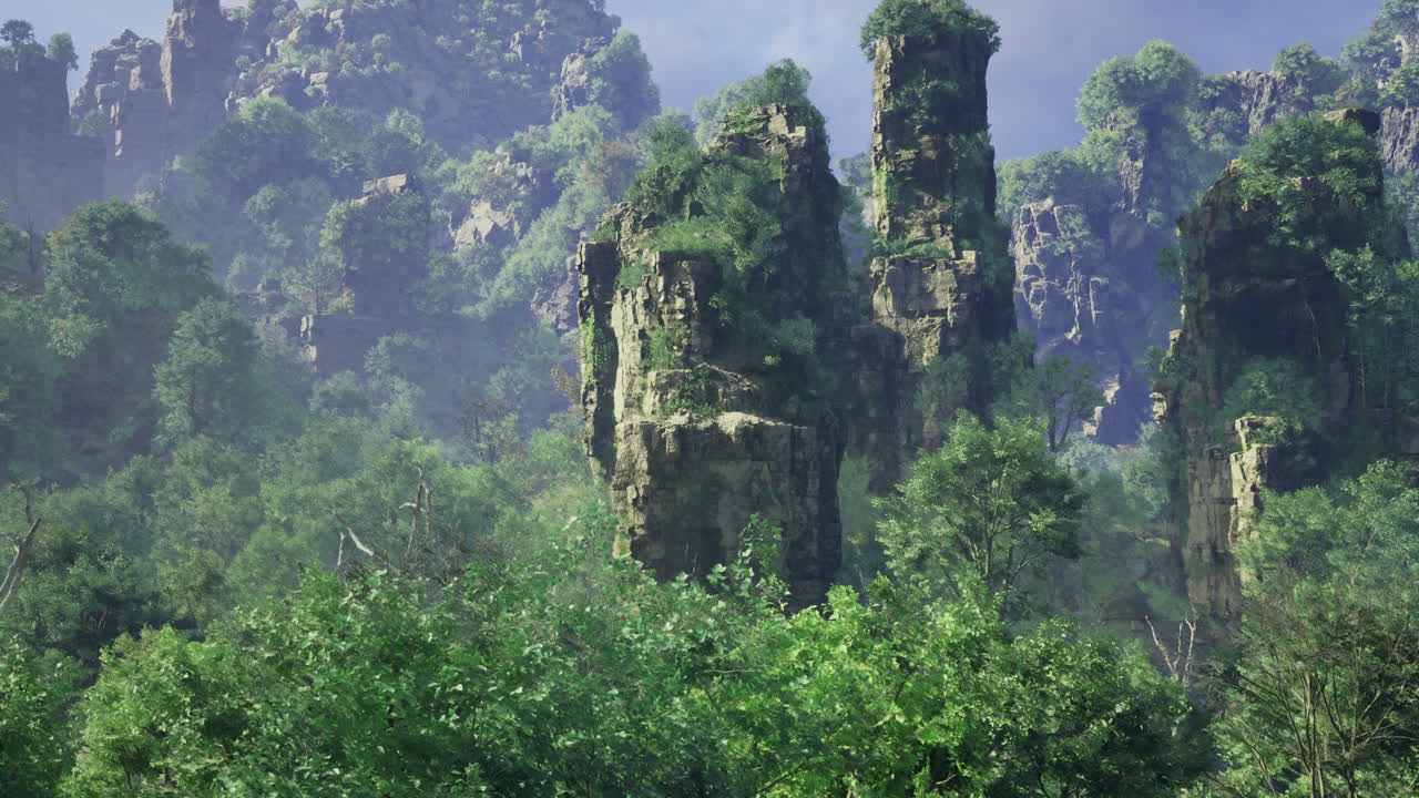 Majestic rock formations tower over lush green forests at dawn