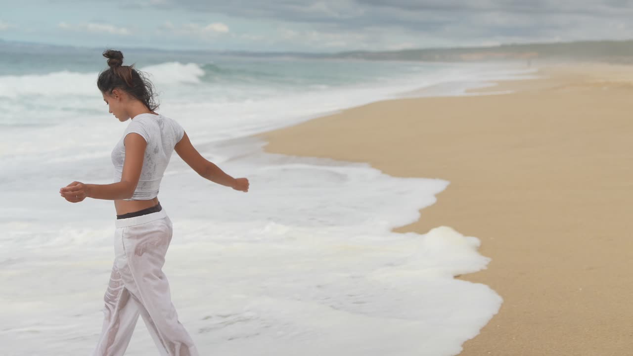 Woman enjoying a relaxing walk on a beautiful beach