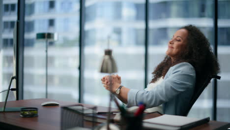 Satisfied-professional-enjoy-in-skyscraper.-Smiling-girl-celebrating-victory