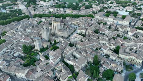 high angle aerial uzès duchy castle - medieval old town france reveal