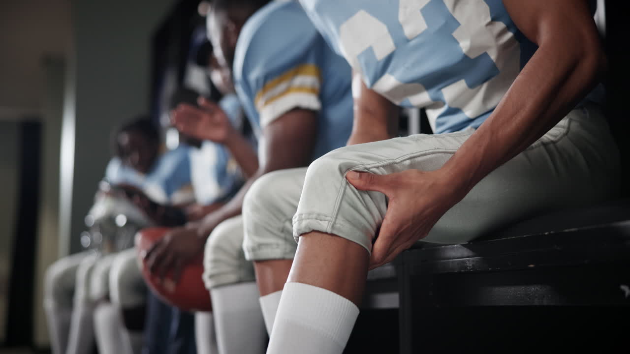 Football Team in Locker Room