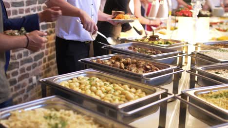 people group catering buffet food indoor in luxury restaurant with meat colorful fruits and vegetables.