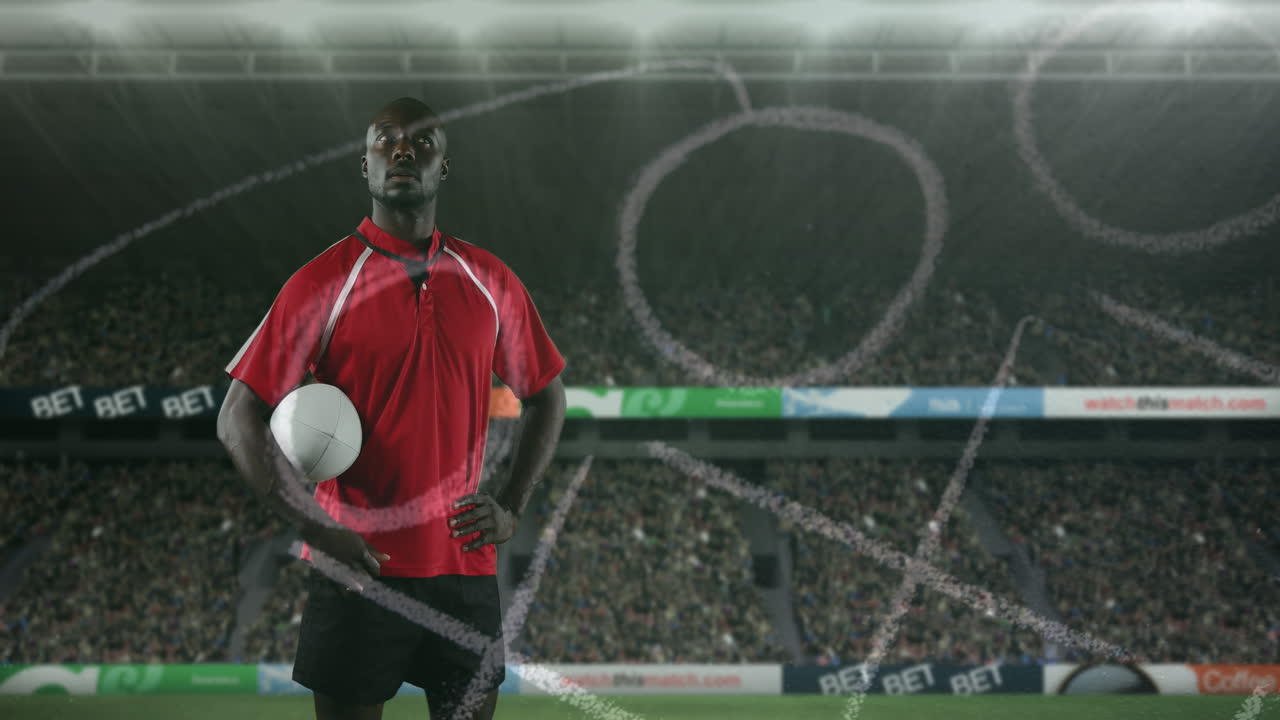 animación del plan de posición sobre un hombre afroamericano con una pelota de rugby en el estadio