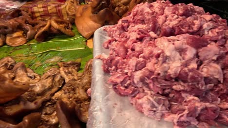 various meats showcased at a market stall