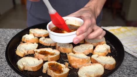 man making flavored toast at in the kitchen at home