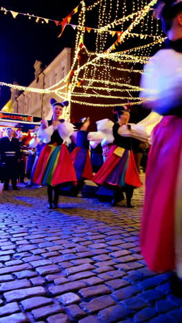 folk dance performance at a night market