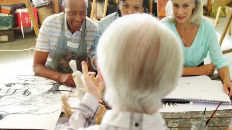 artists working together at table 4k