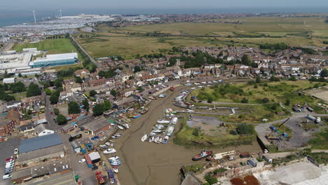 wide aerial pullback revealing queenborough and sheerness town - docks on the isle of sheppey, kent, uk