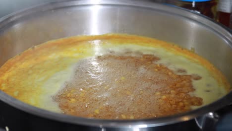 slow motion of cooking dhal in hot water