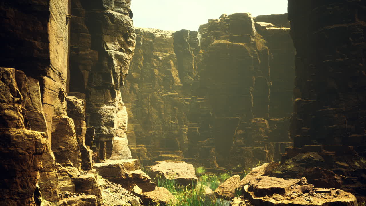 Vibrant green foliage among towering rock formations in a canyon