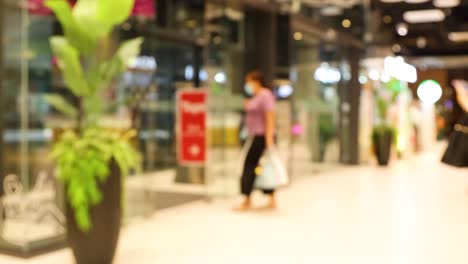 people walking in a busy shopping mall