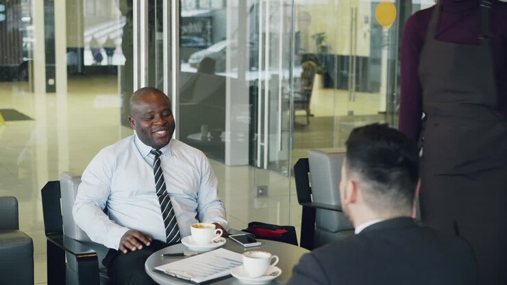 Business Meeting in Modern Cafe