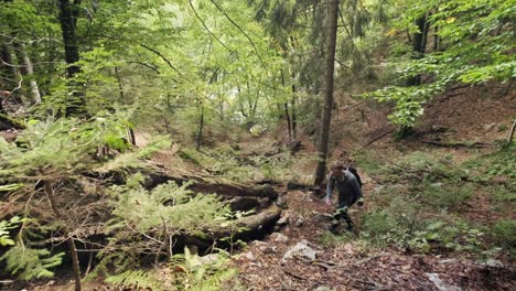 Man-walking-through-Pokljuka-Gorge-in-Slovenia-during-spring-in-the-Triglav-National-Park-6