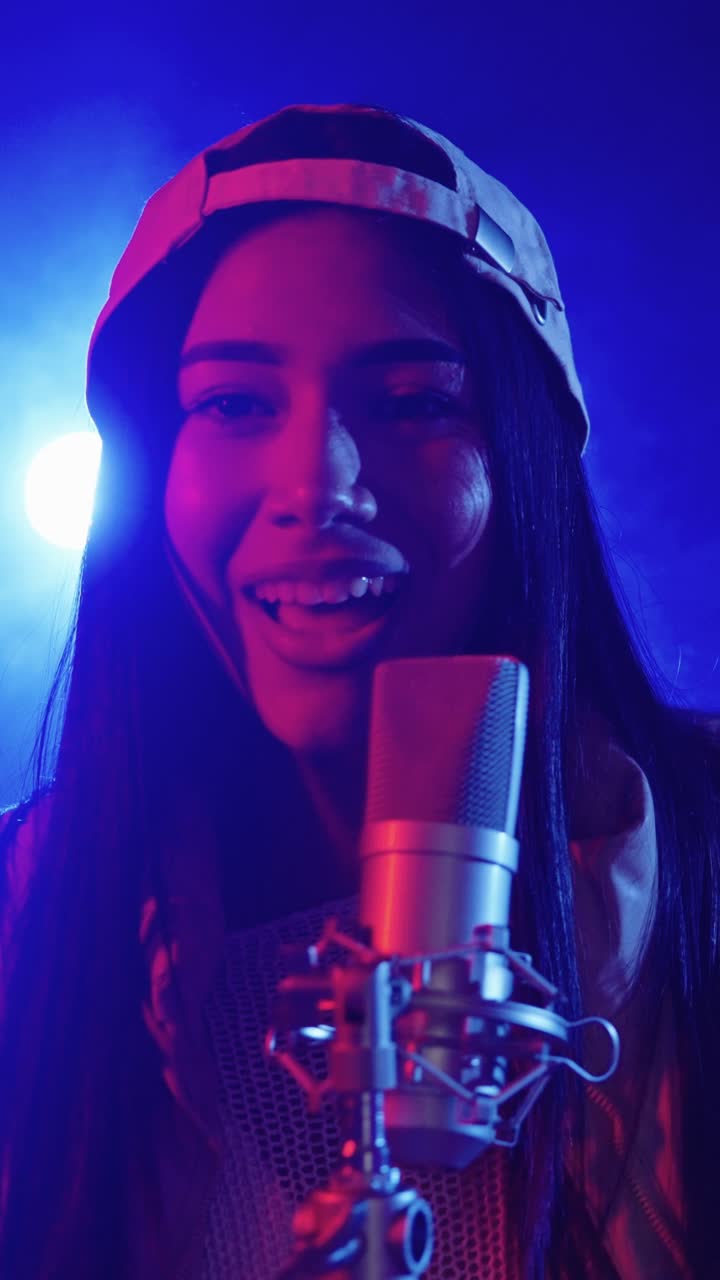 Woman singing into a microphone