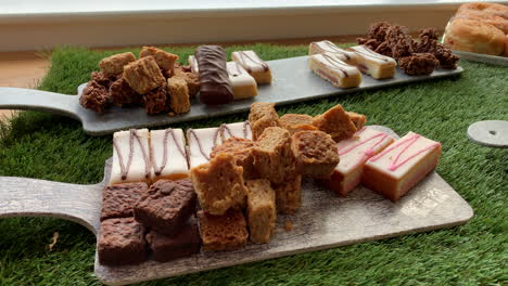 sweet selection of deserts and cakes with chocolate brownies and flapjacks