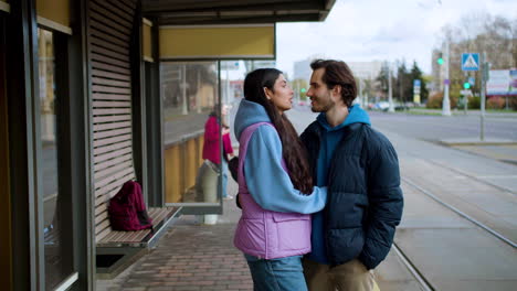 couple at bus stop