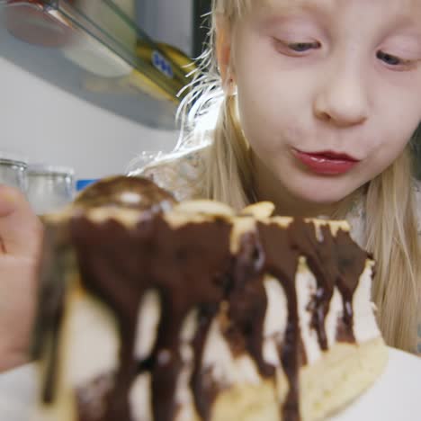 a little girl secretly tastes the cake in the fridge 2