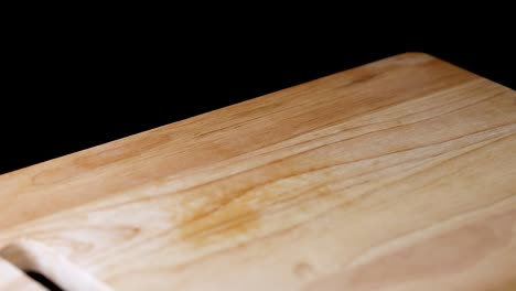 persimmon pieces bounce on a wooden board