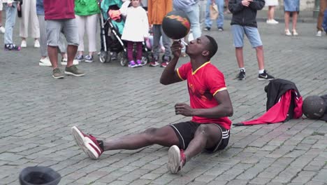 man playing ball in grand place in brussels