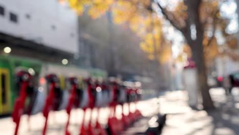 blurred view of scooters lined up on street