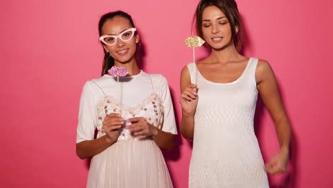 two women with party props