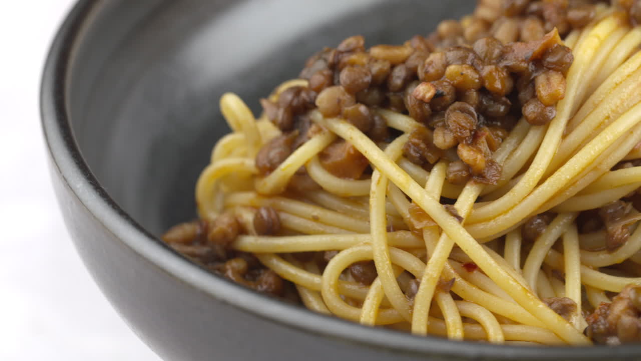 Vegan Pasta, Vegan Spaghetti Dish, Lentil Pasta. Spinning Bowl Of Vegetarian Pasta