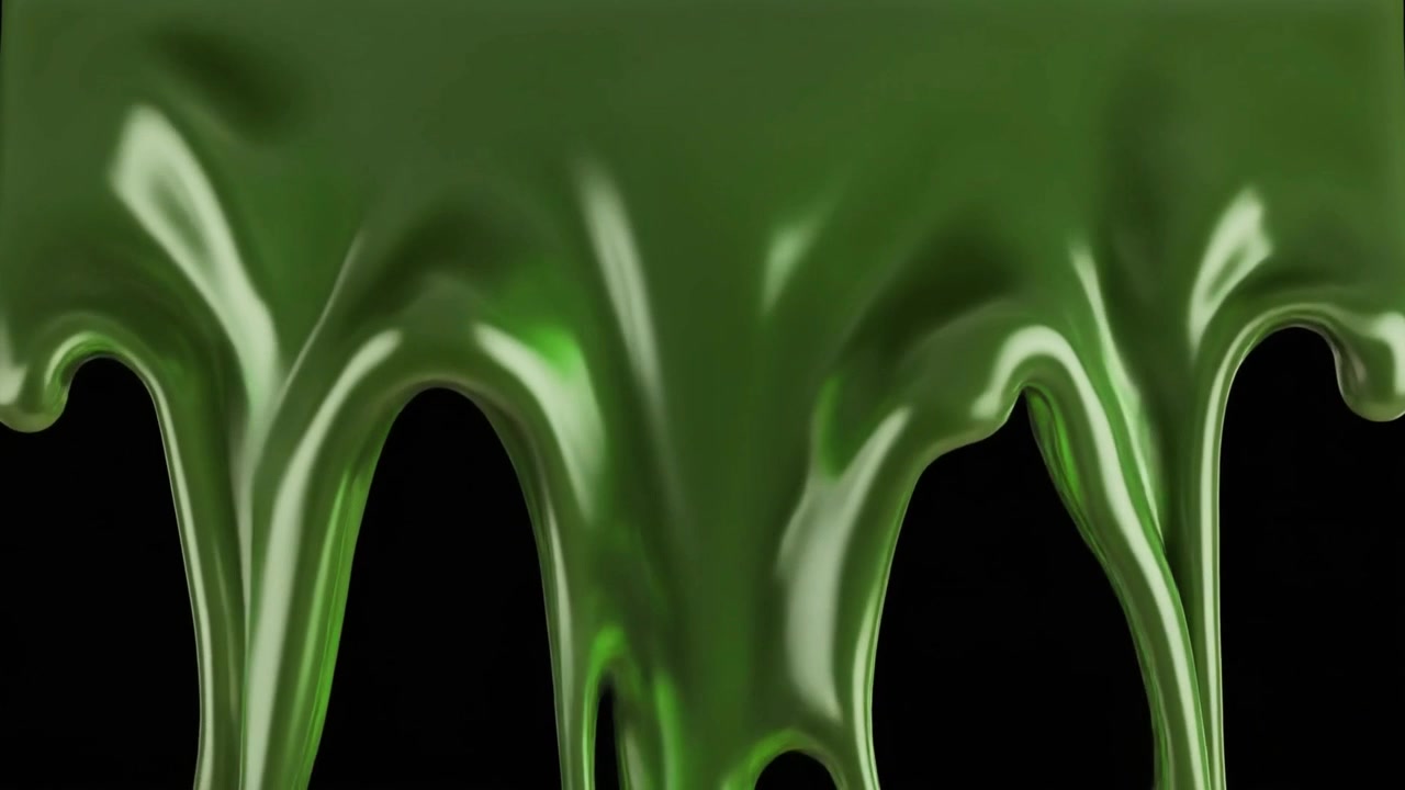 Dikke groene vloeistof die naar beneden druipt tegen een zwarte achtergrond