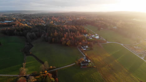 scenic top aerial view of autumn countryside landscape at golden hour