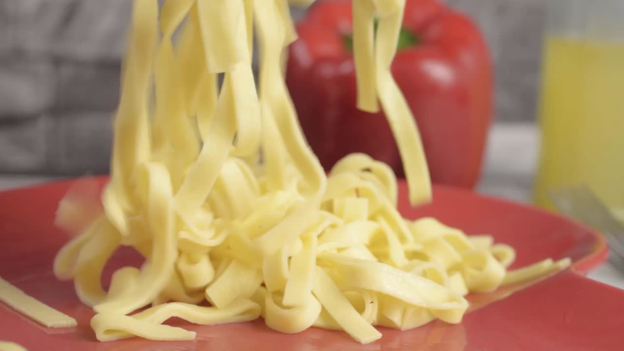 Serving freshly cooked tagliatelle pasta medium shot