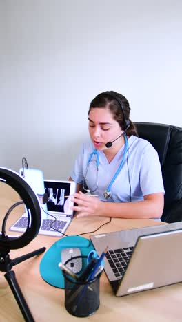 doctor traumatologist examines x-ray and legs. physician looking at x ray scan results on tablet, healthcare online.
