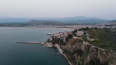 Aerial-view-of-the-iconic-coast-city-of-Nafplion-in-Greece-during-sunset