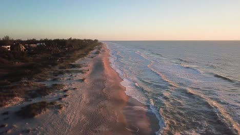 wide circular pan of the beach with waves on captiva island, florida