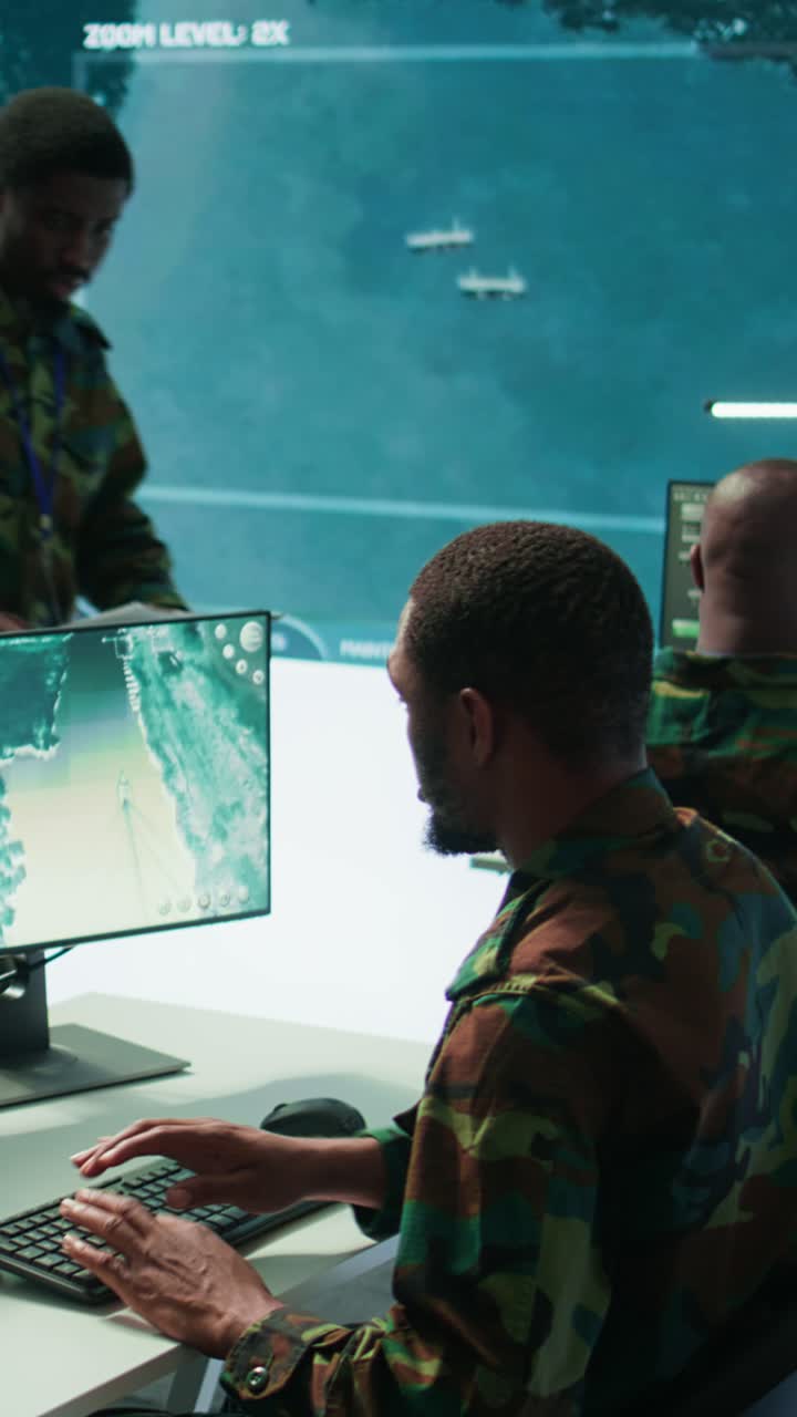 Vertical Video Military experts in mission control center use modern technology on computer