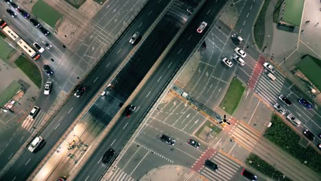 Top down night city roads with cars driving aerial view