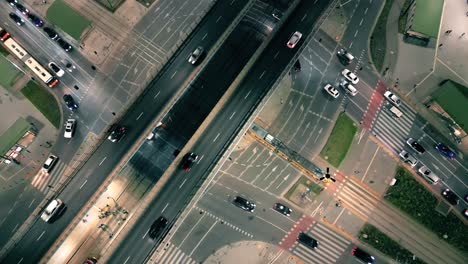 top down night city roads with cars driving aerial view