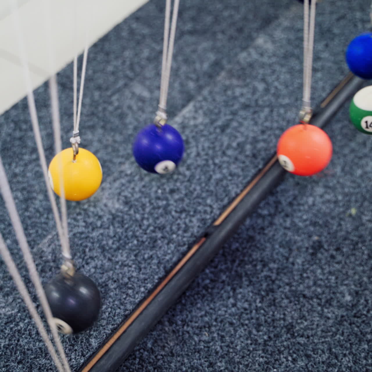 Balancing balls of Newton's cradle. Museum of Science