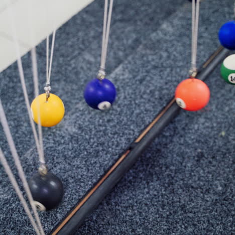 Balancing balls of Newton's cradle. Museum of Science